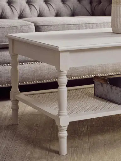 White Wooden Coffee Table with Cane Webbed Lower Shelf and Carved Spindle Legs, Heritage